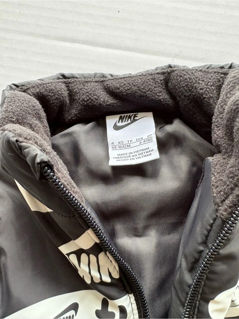 Nike Black Kids Puffer Vest with White Graphic Yoke-Size 4